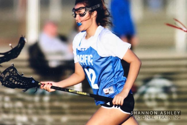 Woman playing fielf hockey